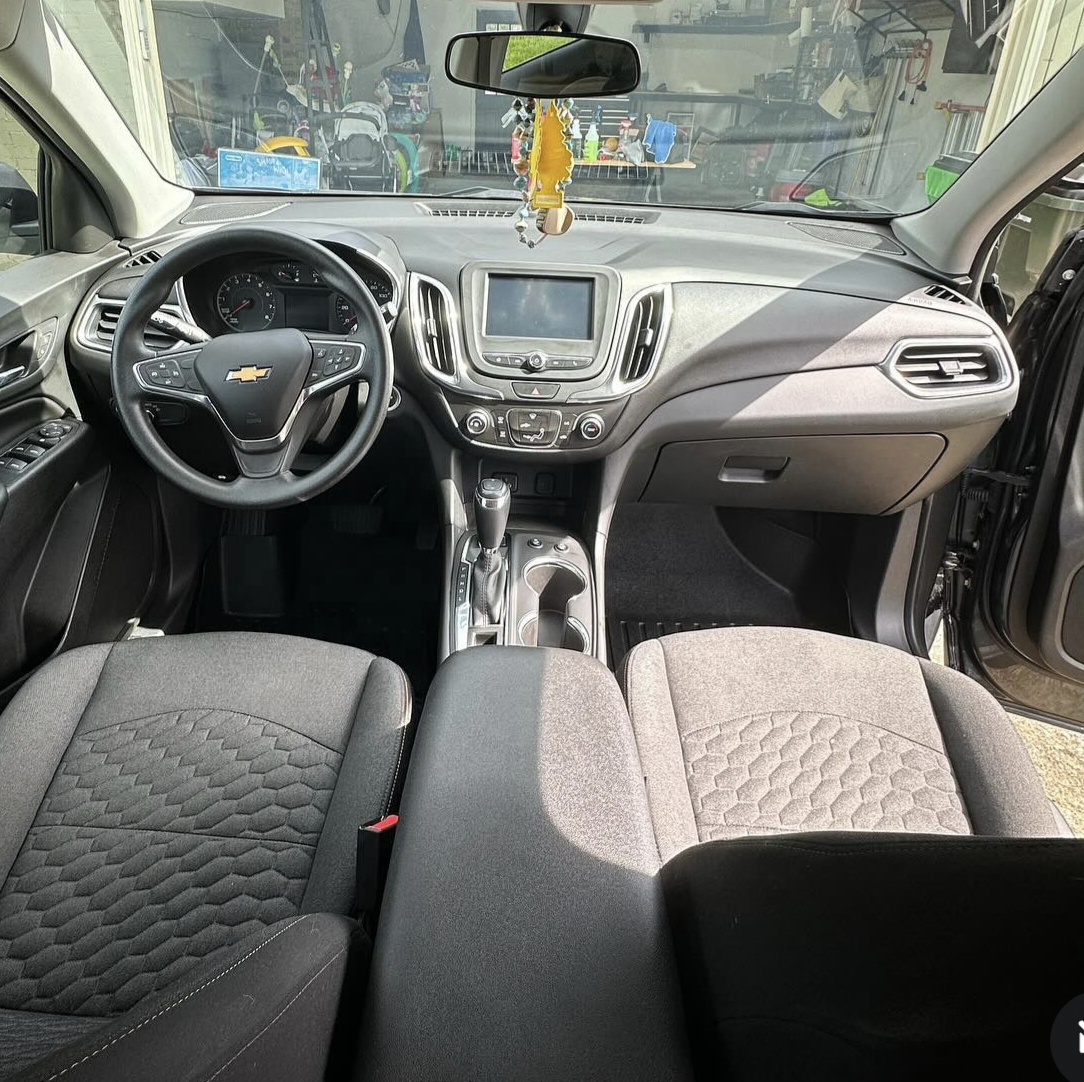Chevy Equinox interior with vacuumed seats, clean dash and streak-free glass